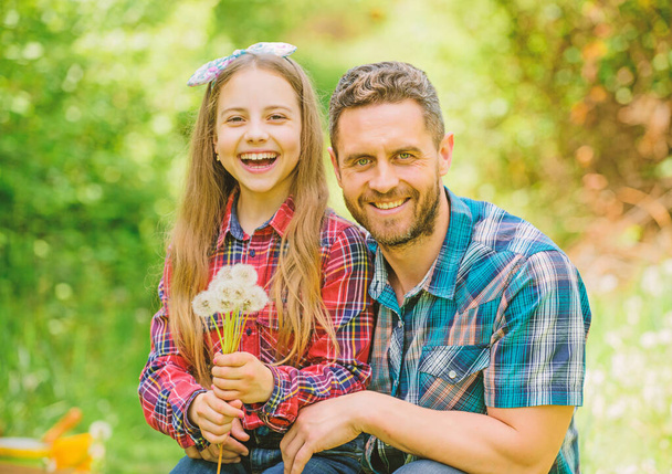 little girl and happy man dad. earth day. family summer farm. spring village country. daughter and dad love dandelion flower. ecology. Happy family day. Horticulture activities. Fond of horticulture - Fotoğraf, Görsel