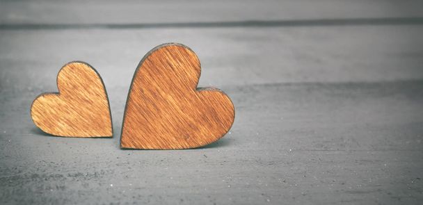 Two wooden hearts on the wooden table - Φωτογραφία, εικόνα