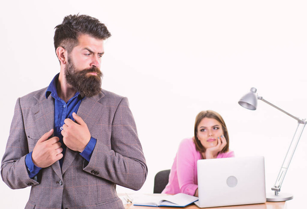 Formal elegance. Confident business man and coworker in office. Bearded man with pretty woman working in background. Brutal caucasian man in business attire. Man with long beard in formal wear - Фото, зображення