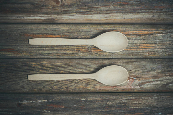 Beautiful bright wooden spoons for food and spices. - Foto, Imagen