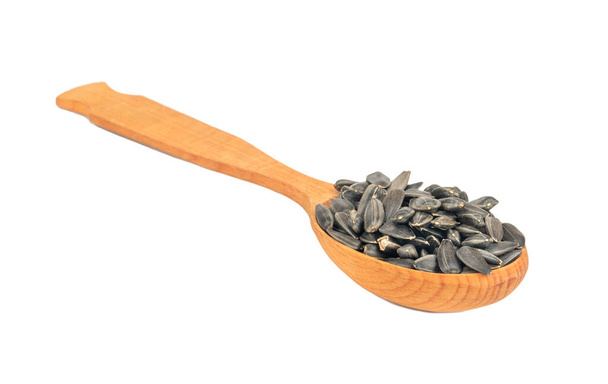 Sunflower seeds in a spoon - Photo, Image