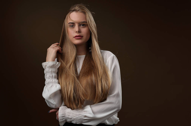 Beautiful girl with long hair in white blouse - Fotografie, Obrázek