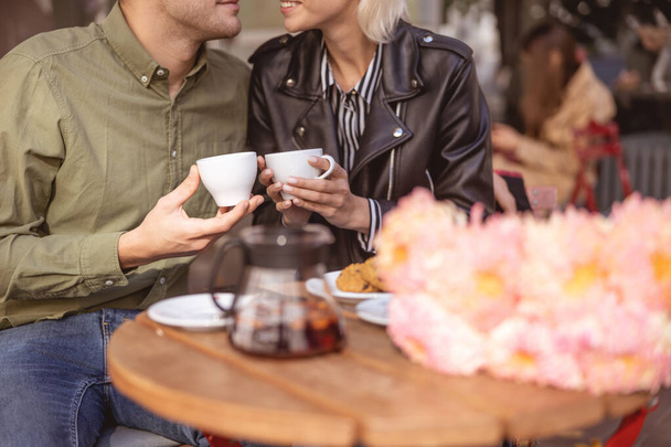 Young people in love drinking coffee together - Фото, зображення