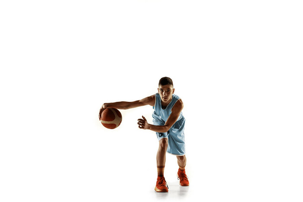 Full length portrait of a young basketball player with ball - Fotó, kép