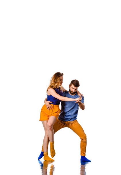 A couple of young man and woman dancing hip-hop at studio - Fotoğraf, Görsel