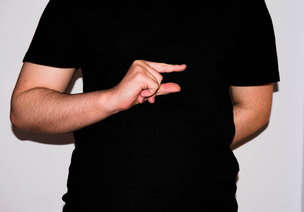 Young sign-language interpreter, showing a "G" in American Sign Language - Photo, image
