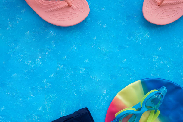 pink coral flip flops on blue textured background - Foto, Imagem