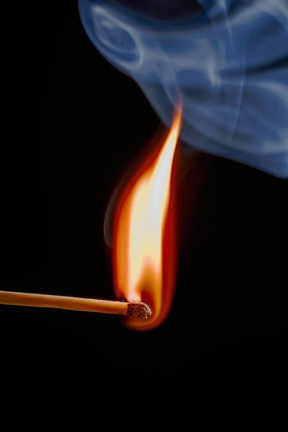 Safety match on black background with flaming head - Photo, Image