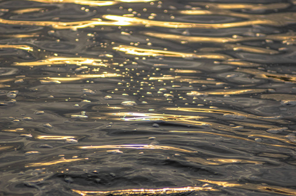 Waves at sunset on the river water - Photo, Image