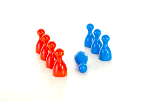 Group of meeples bullying blue meeple at workplace - Photo, Image