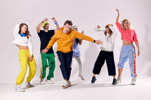 Group of young hip-hop dancers in studio - Photo, image
