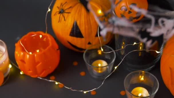pumpkins, candles and halloween decorations - Footage, Video