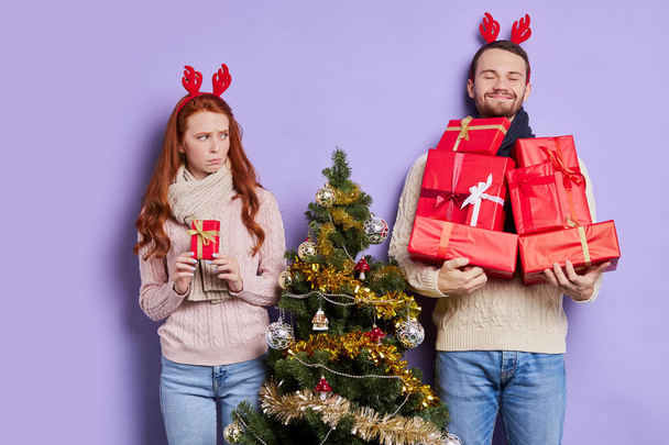Pretty couple with stack of gifts - Foto, Imagem