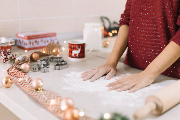 Womans hands over kitchen countertop with spilled flour - Zdjęcie, obraz