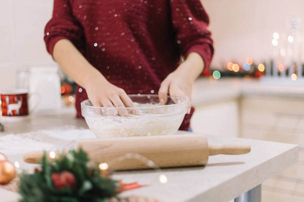 Girls hands kneading dough for Christmas cookies - Фото, изображение
