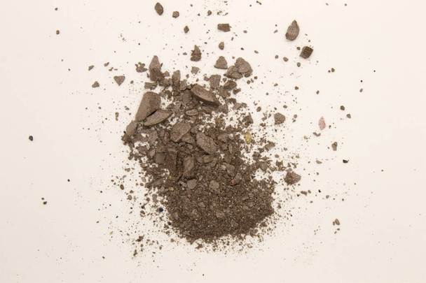 This is a photograph of deep Taupe powder Eyeshadow isolated on a White background - Valokuva, kuva
