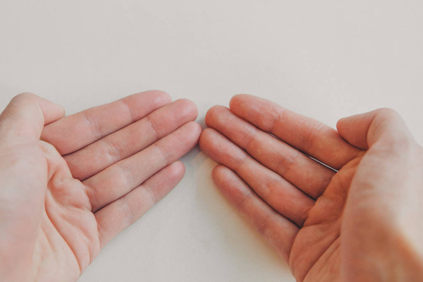 hands on white background. the concept of manifestation of emotions, gestures: petition, prayer - Φωτογραφία, εικόνα