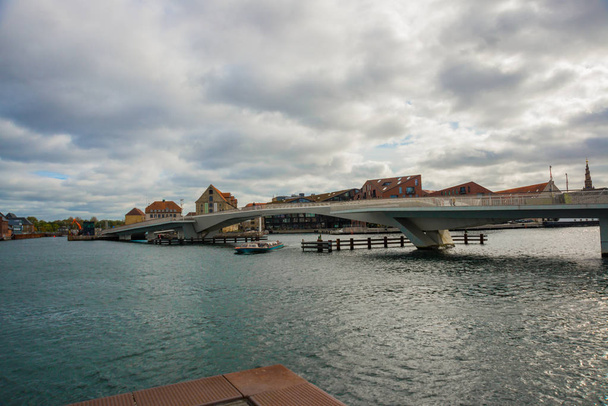 COPENHAGEN, DENMARK: Beautiful panoramic view from the waterfront to the buildings and the river. - Fotó, kép