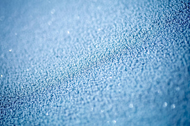Blue frost on glass. Hoarfrost background close up, copy space - 写真・画像