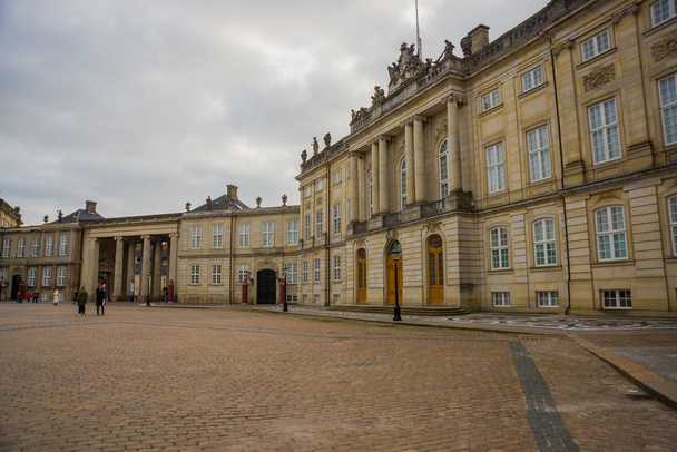 COPENHAGEN, DENMARK: Amalienborg Palace is the winter home of the Danish royal family, and is located in Copenhagen - Фото, изображение