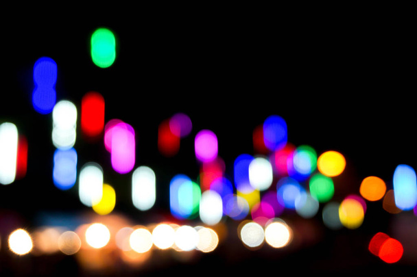 Blurred and bokeh with long short view reflection colorful lighting of city and night life. By the way to look like the sound graphic equalizer - Photo, Image