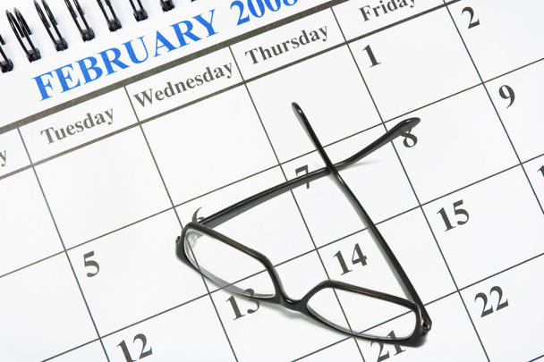 Kalender und Brille - Foto, Bild