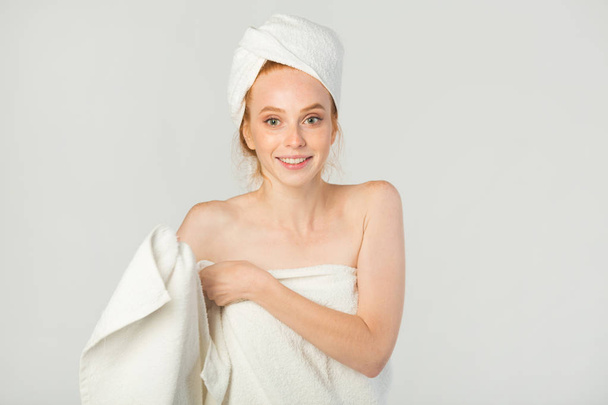 beautiful young woman in a white towel - Zdjęcie, obraz