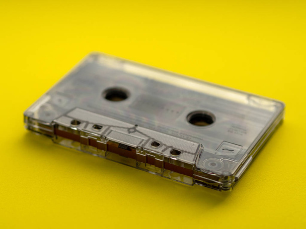 Audio cassette tape on yellow backgound. - Valokuva, kuva
