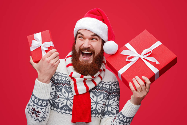 Delighted man with Christmas gifts - Fotoğraf, Görsel