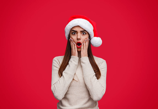 Shocked young lady celebrating Christmas - Zdjęcie, obraz