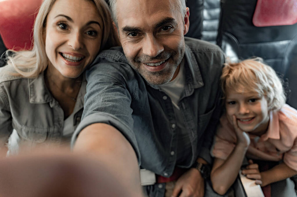 Happy family is making selfie in cabin - Foto, immagini