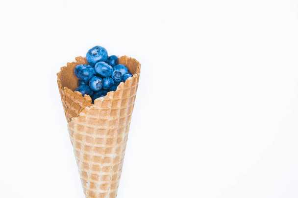 blueberries and horn. Blueberry Blast. Photo of blueberries in a waffle cone. View from above. High Resolution Product. - Photo, Image