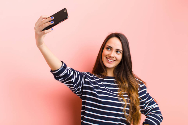 young pretty woman using her smart telephone - Foto, Bild