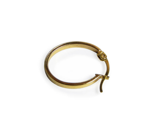 Round gold earring. - Photo, Image