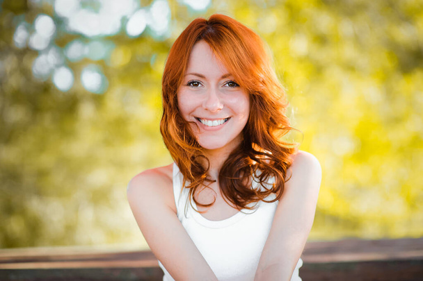The girl of the sun. Beautiful cheerful girl smiling. Red hair. positive emotion. life is beautiful. - Photo, Image