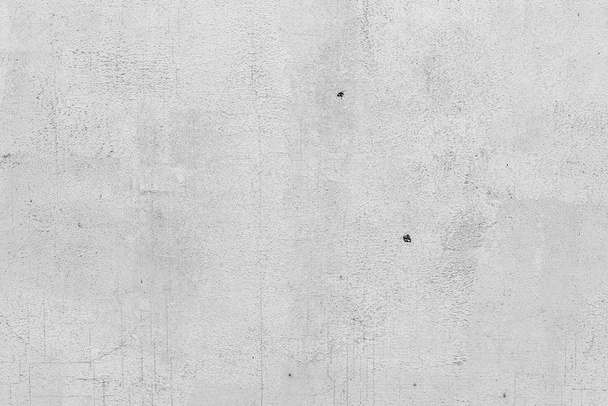 struttura di una parete di cemento con incrinature e graffi che possono esser usati come uno sfondo - Foto, immagini