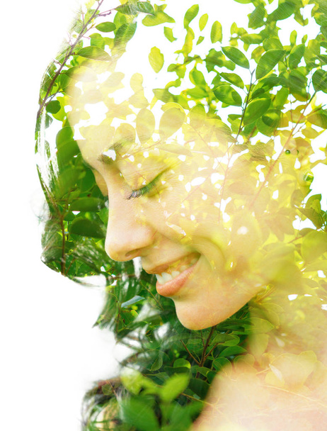Double exposure profile portrait of a happy woman looking down c - Photo, image