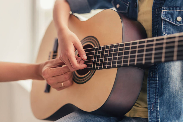 Faceless person playing guitar - Φωτογραφία, εικόνα