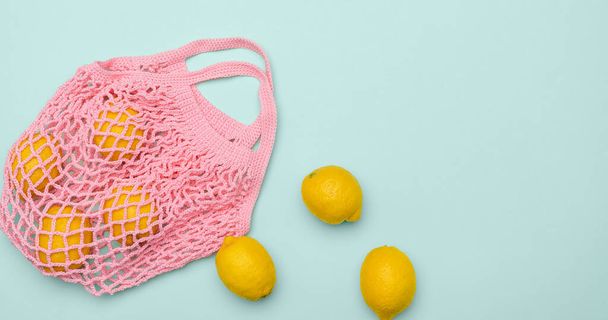 Pink bag with fresh lemons - Foto, immagini