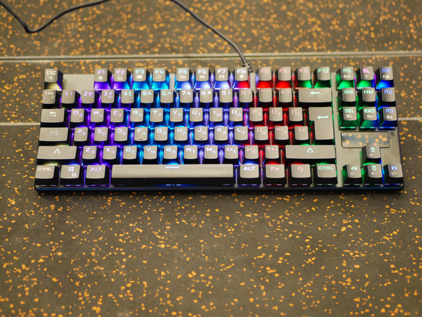 multi-colored keyboard. mechanical keys. Multi-colored professional gaming mechanical rgb keyboard on the table background  - Foto, immagini