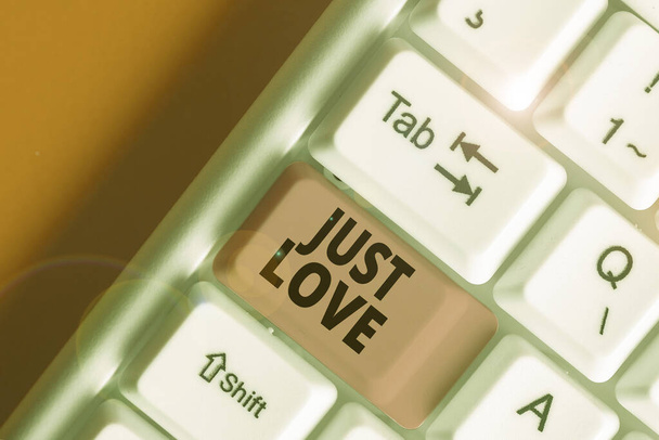Escribiendo nota mostrando Just Love. Foto de negocios mostrando estar interesado físicamente en alguien Un apego emocional
. - Foto, Imagen