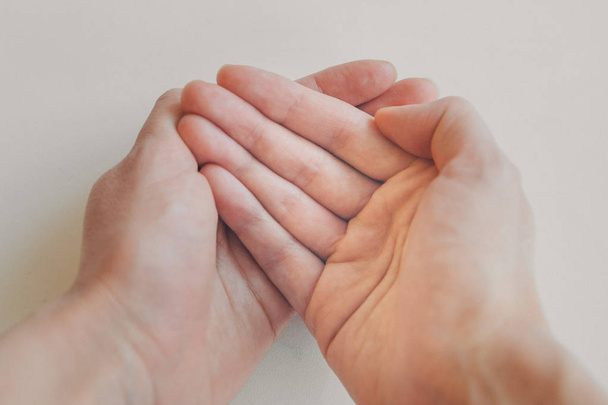 hands on white background. the concept of manifestation of emotions, gestures: petition, prayer - Φωτογραφία, εικόνα