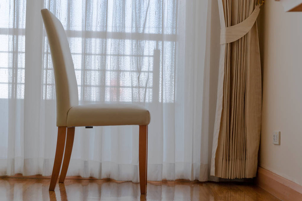 Wooden chairs in the white room. chair near the window with a wh - Photo, Image