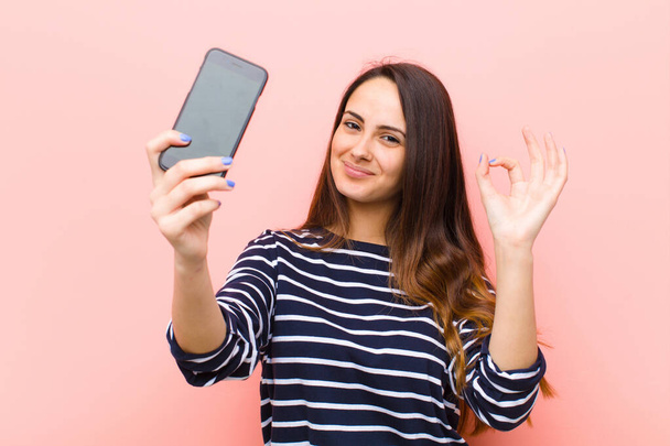 young pretty woman using her smart telephone - Фото, зображення