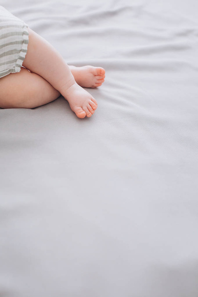 little baby feet bed delicate textile conceptual - Foto, Bild