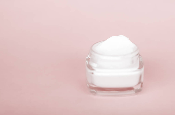 Face cream moisturizer jar on beige background, moisturizing ski - Photo, Image