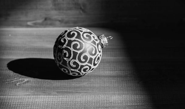 Christmas ball decoration on blue vintage wooden background. Decorate christmas tree with traditional toys. Symbol of new year and christmas holidays. Celebrate christmas. Winter holiday concept - Photo, image