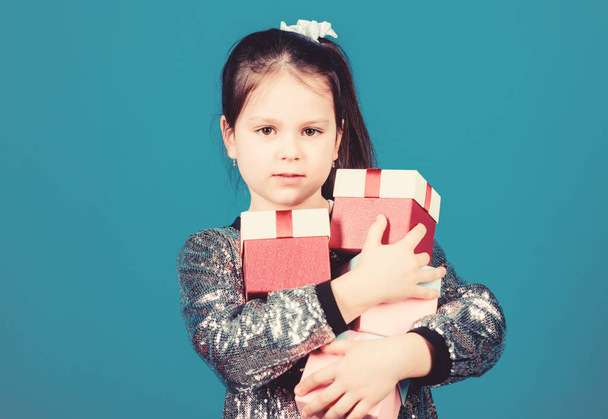 Special happens every day. Girl with gift boxes blue background. Black friday. Shopping day. Child carry lot gift boxes. Surprise gift box. Birthday wish list. World of happiness. Only for me - Fotoğraf, Görsel