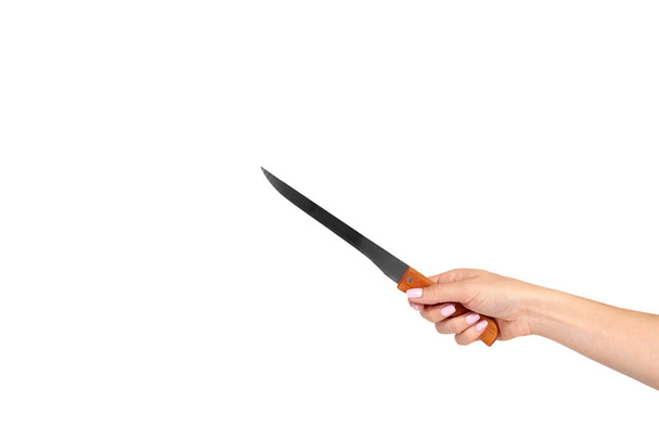 Hand with kitchen knife, home utensil, wooden handle. - Photo, Image