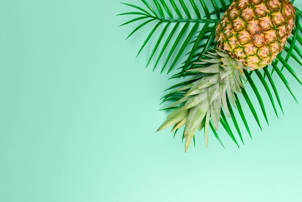 Summer background with hat and pineapple. Copy space. - Фото, изображение